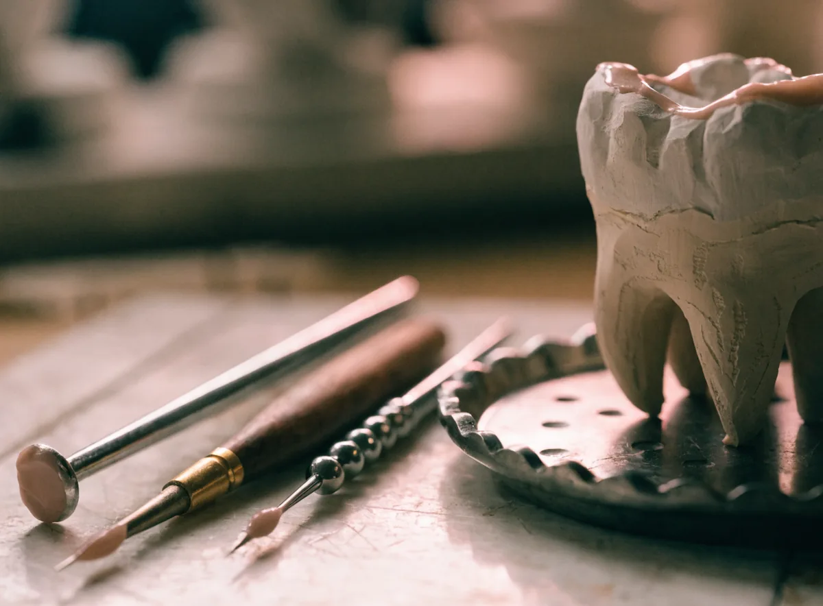 Crown and bridge waxing instruments with a plaster model (illustrative)