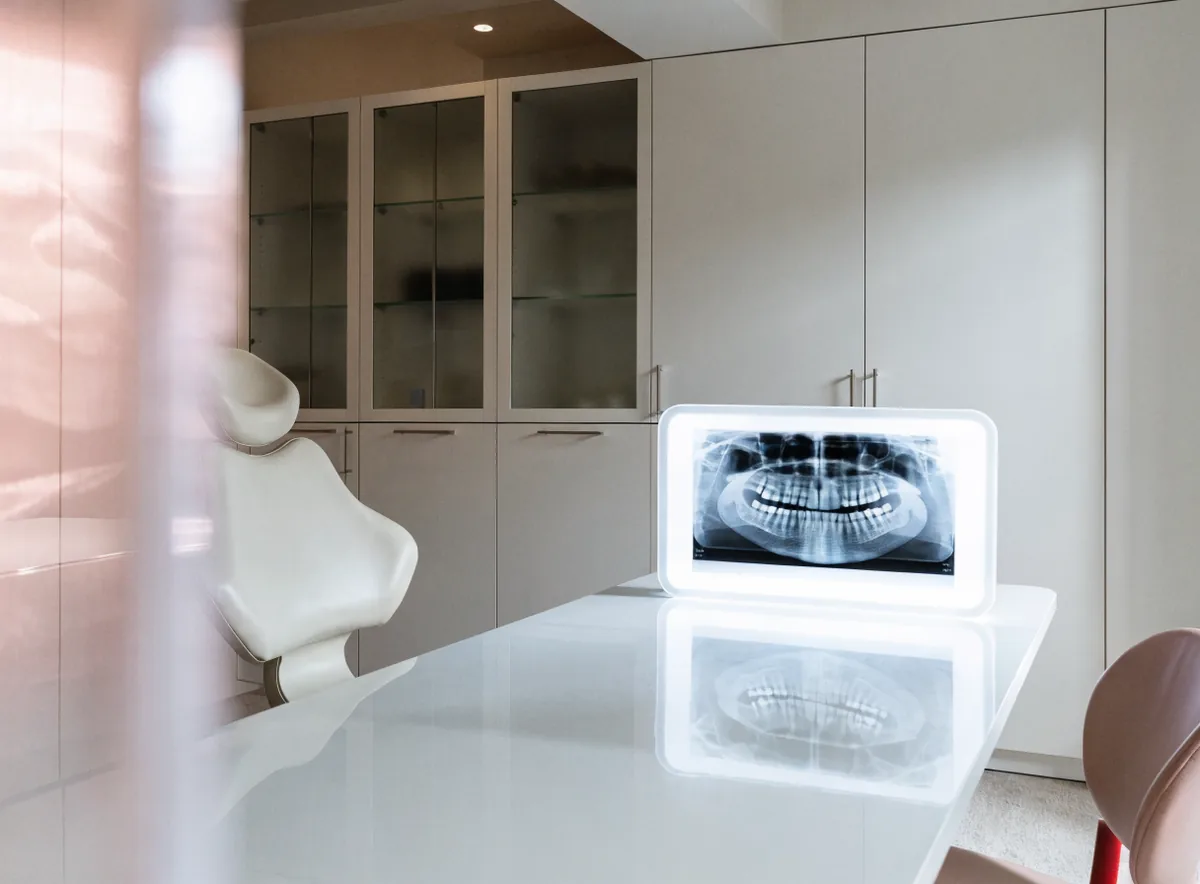 Panoramic dental X-ray on a lightbox (illustrative)